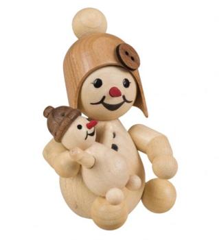 Schneemädchen mit Puppe